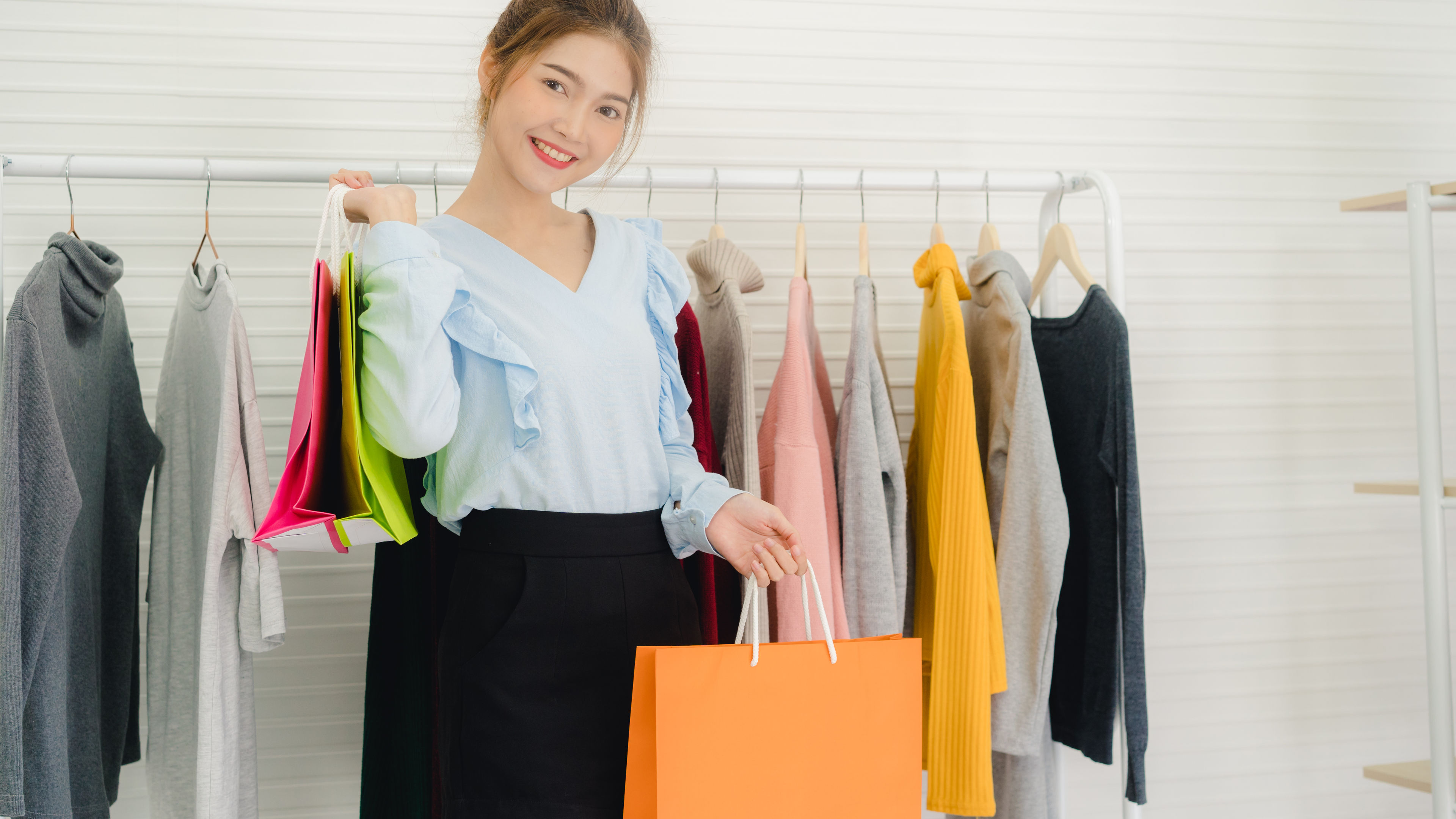 Asian girl purchasing dresses